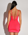 Women wears Mini Wrap Skirty Built-in Shapewear Swim Cover-Up - Hot Coral back view