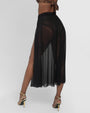 Model wears Ringy Sheer Slit Skirty - Black Cover Up Midi Skirt back view