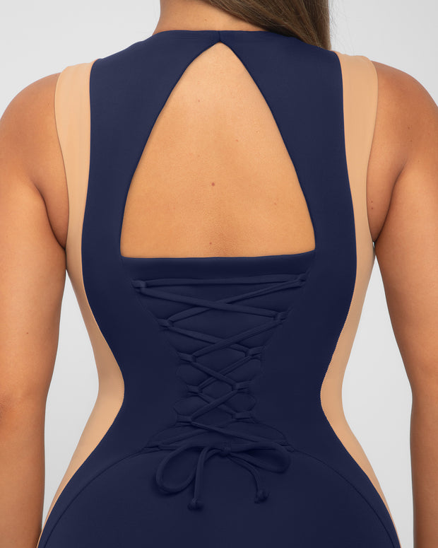 Model wears Illusion Column Midi Shapewear Dress - Contour Midnight/Sand open back close up