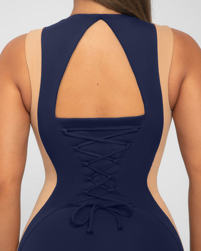 Model wears Illusion Column Midi Shapewear Dress - Contour Midnight/Sand open back close up