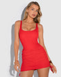 Model wears Mini Triangle Skirty Waterproof Shapewear Cover-Up - Red and one piece red swimsuit