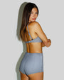 Model wears Boy Shortie Full Butt Coverage Shapewear Bottom - Gingham side view