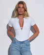 Model wears Short Sleeve Corsety Sculpting Shapewear Top - White with jeans close up