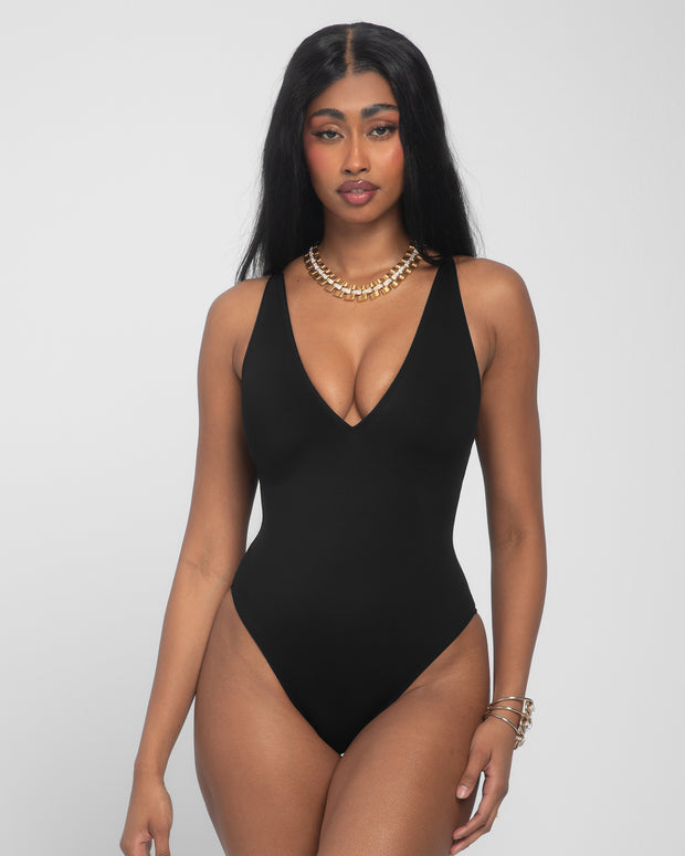 Model wears Brazilian Plungey Cheeky One Piece Shapewear Swimsuit - Black front view