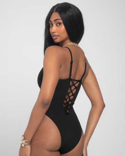 Model wears Brazilian Plungey Cheeky One Piece Shapewear Swimsuit - Black back view