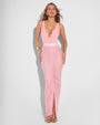 Model is posing in Ruched Sheer Side Slit Maxi Skirty - Flamingo Pink and matching color one piece swimsuit