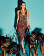 Model wears Sarong Skirty Knee Length Faux Wrap Cover-Up - All Over Leopard with a matching swimsuit