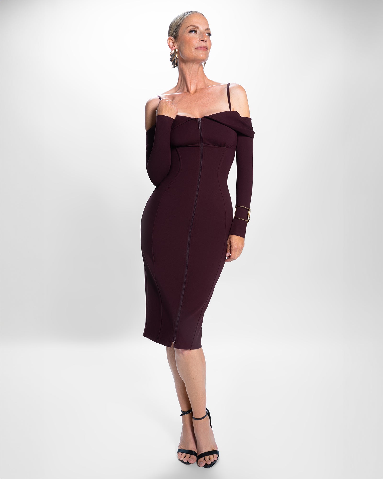 Model posing in Corsety Off Shoulder Long Sleeve Dress - Garnet full body front view
