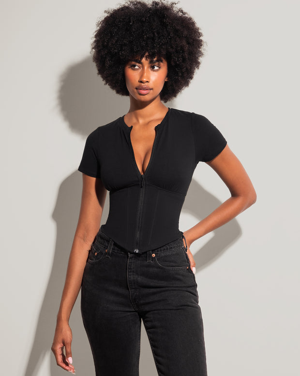 Model wears Short Sleeve Corsety Sculpting Shapewear Top - Black front view