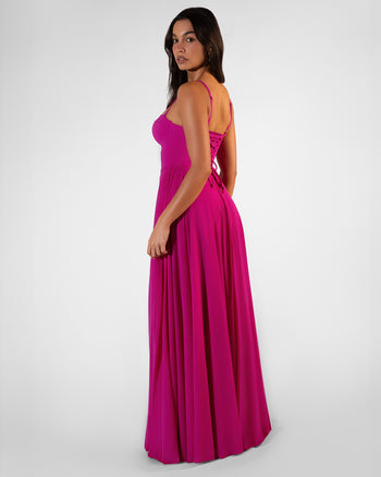 Back view of Bombshell Maxi Dress - Electric Fuchsia full body on model