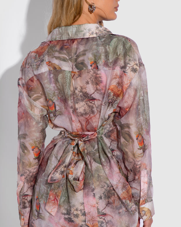 Model is posing in Flowy Oversized Collared Button Front Shirt - Soft Tropical close up back