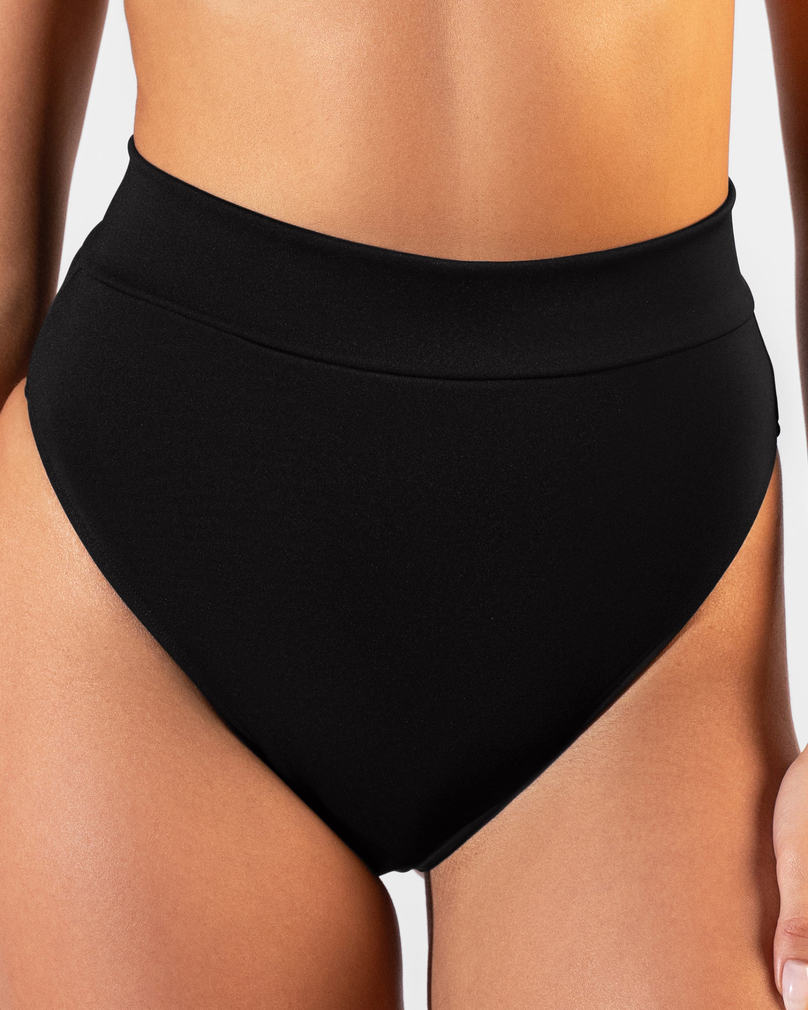 Close up image of Hi Cut Adjustable Kini Bottom - Black on model