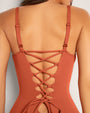 Model wears Hi Cut Plungey Triangle One Piece Shapewear Swimsuit - Baked Clay back view close up