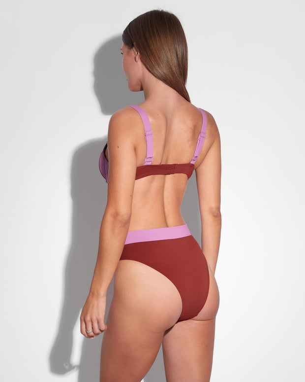 Model wears Brazilian Ring Kini Bottom - Copper/Lilac Two Piece Shapewear back view