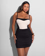 Model is wearing Mini Ruched Skirty Waterproof Shapewear Swim Cover-Up - Black front view
