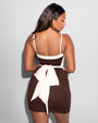 Model is wearing Mini Ruched Skirty Waterproof Shapewear Swim Cover-Up - Espresso back view