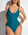 Model is posing in Plungey - Wavy Ring Oceana Open Back One Piece Shapewear Swimsuit front view close up
