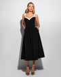 Model wears Poplin Fit & Flare Midi Shapewear Dress - Black/Ivory front view hands in pockets