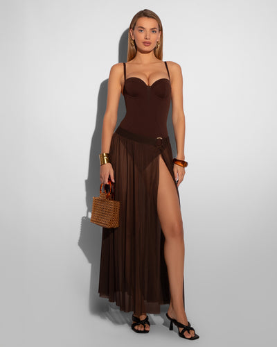 Model wears Ringy Sheer Slit Skirty - Espresso Cover Up Midi Skirt and one piece swimsuit full front view