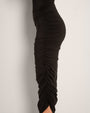 Model wears in Goddess Shaping Shapewear Midi Skirt - Black close up side view
