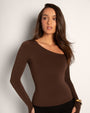 Model wears Sculpty One Shoulder Long Sleeve Shapewear Top - Espresso front view