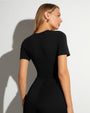 Model wears Sculpty Short Sleeve Shapewear Tee - Black back view
