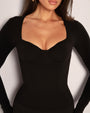 Model wears Sweetie Long Sleeve Sculpting Shapewear Top - Black cups close up