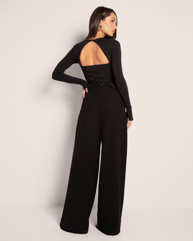 Model wears Pleaty Wide Leg Pleated Pant - Black with a top full back view