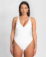 Model wears Brazilian Plungey Cheeky One Piece Shapewear Swimsuit - White front view