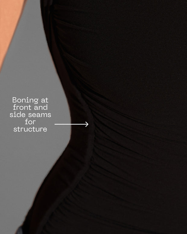 Graphic highlighting the front and side boning on Shapey Ruched Short Sleeve Top - Black