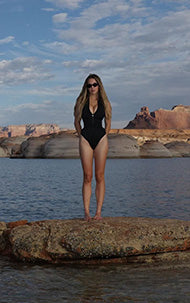 Sydney Sweeney wearing TA3's hi cut sleeveless surfy in color black